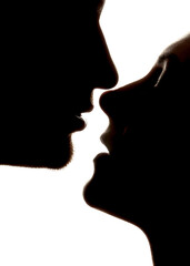 Silhouette of a couple kissing 
