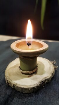 Burning Bamboo Candle on Wooden Slice, Eco-Friendly Candlelight