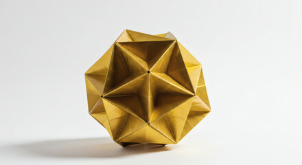 A detailed shot of a golden, intricate origami polyhedron sculpture against a clean white background.