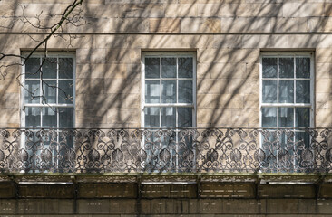 A stunning view of Leazes Terrace is an elongated square of houses with Wrought iron black railings balconies and Glass windows in Newcasle, is a Grade I Listed Building which encloses a courtyard.