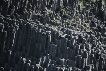Background of basalt columns creating a geometric texture in nature