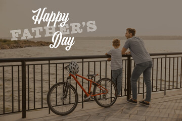 Father and his little son with bicycle near river