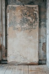 Naklejka premium Weathered Panel Against Distressed Wall: A Rustic Still Life
