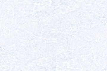 White water with ripples on the surface. Defocus blurred transparent white colored clear calm water surface texture with splashes and bubbles. Water waves with shining pattern texture background.