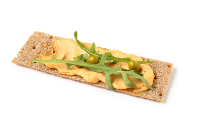 Crispbread with tasty hummus and arugula on white background