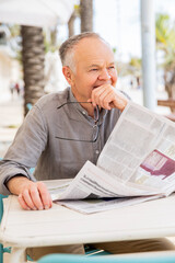 Vintage lifestyle, senior man with newspaper
