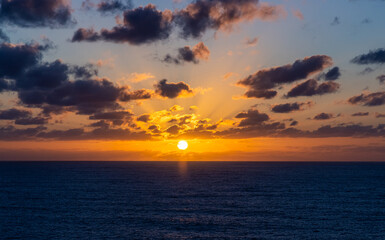 Beautiful Ocean Sunset With Vibrant Clouds Over The Pacific Horizon