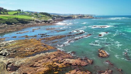 Experience a breathtaking coastal view featuring spectacular rocks and beautiful turquoise waters