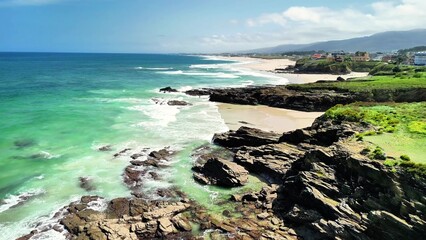 Experience the stunning beauty of a coastal landscape with turquoise waters and sandy shores