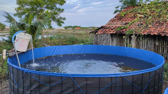 blue tarpaulin pool with homemade recirculating water filtration
