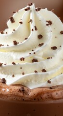 Fototapeta premium Indulgent hot chocolate crowned with fluffy whipped cream and adorned with delightful chocolate shavings, a sweet treat for any occasion.