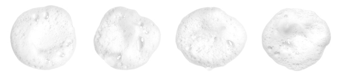 Liquid white foam from soap, shampoo or bath foam. Abstract soap bubbles. Set of soap bubbles. Separated soap bubbles on white background with contrasting texture.
