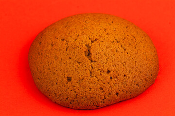 Freshly baked soft cookie on red background