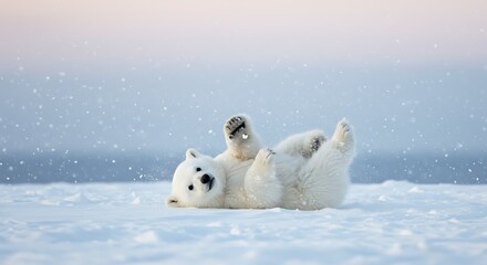 
A polar bear cub tumbling around and playing in a snowy landscape, with a soft winter sky above and snowflakes gently falling