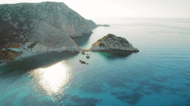 Aerial view of a crystal clear turquoise bay surrounded by dramatic cliffs in Kefalonia Greece