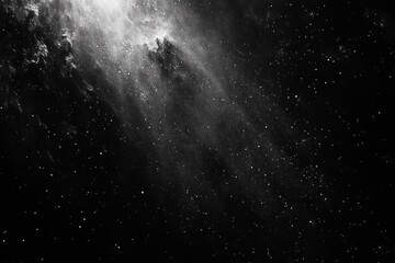 Black and white image of a cosmic scene with dense stars and bright nebulous formations creating a sense of vastness and mystery in space