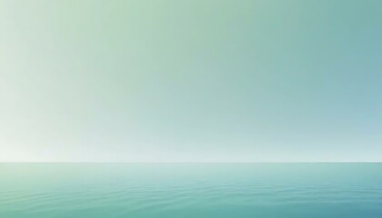 Obraz premium Calming turquoise and pale green gradient fills the horizon over a serene and gently rippling sea.