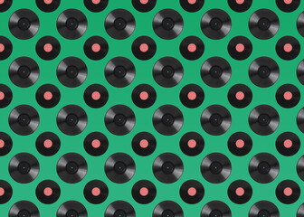 Pattern of vinyl records on green background