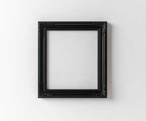 empty ornate black picture frame hanging on clean white wall with detailed floral design in corners
