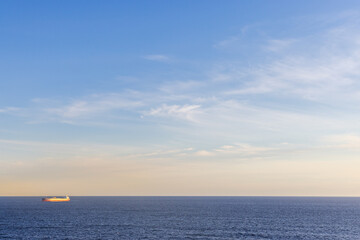 Cargo Ship on Pacific Ocean With Clear Sky in British Columbia, Canada