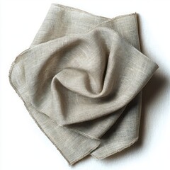 Beige textured fabric piece loosely folded with natural linen weave against white background