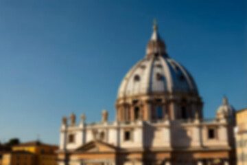 Fototapeta premium blurry church, a church building in the vatican with a clear sky during the day, seen in the photo from the front, with the blurry vatican church in the background