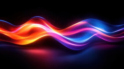 Obraz premium Abstract glowing smooth flowing waves of light in vibrant orange, pink, purple, and blue colors on a dark background creating a sense of motion and energy