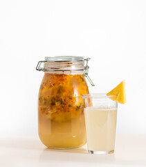  Tepache, fermented mexican pineapple drink, in a glass jar, selective focus