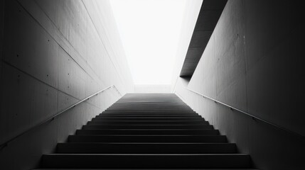 Obraz premium Abstract black and white staircase ascending towards a bright, illuminated opening