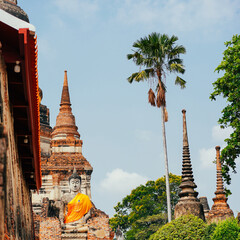 Thailand temple. 1 of most popular tourist attractions in Ayutthaya Historical Park, Thailand is Wat Yai Chai Mongkhon. Selective focus on Big Buddha statue in front of temple Wat Yai Chai Mongkol.