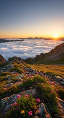 Fototapeta premium Breathtaking mountain vista with vibrant wildflowers overlooking a sea of clouds at sunset, capturing nature's serene beauty.