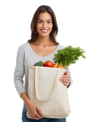 Happy woman holding reusable shopping bag with fresh vegetables, isolated on white background