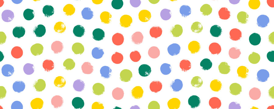 Colorful seamless polka dot pattern. Brush drawn rough multi colored circles. Funky abstract simple background with dots. Hand drawn y2k naive confetti wrapping paper. Kids irregular polka dot pattern
