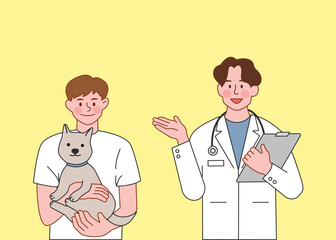 Obraz premium Veterinarian Examining a Cat with Its Owner