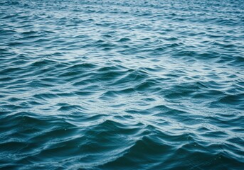 Obraz premium Calm ocean waves, blue water surface background, sea texture