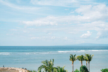 Sanur beach and palm trees in Bali, Indonesia