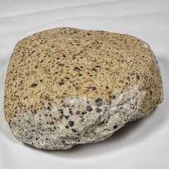 Rough Textured Stone with Speckled Patterns on Smooth Surface. 
