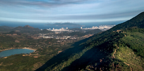 The sunrise on the high mountains, far away is the famous coastal tourist city of Nha Trang