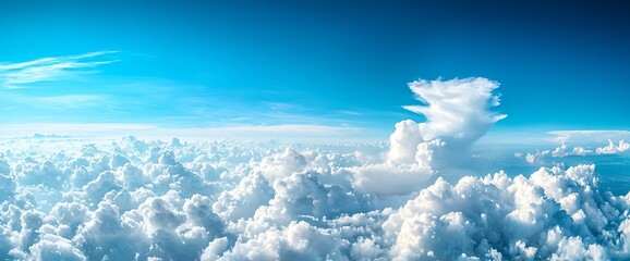 Stunning aerial view of fluffy white cumulus clouds beneath a vibrant blue sky