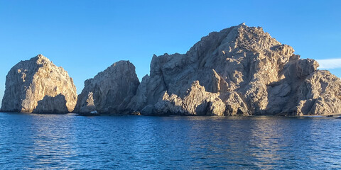 Cabo San Lucas Lands End From Boat Blue Sky with Sun and Shadows