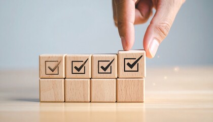 Checklist and task progress tracking concept. A hand ticking off the last box on wooden blocks on a progress bar, task completion, productivity, goal setting, and efficient project management.