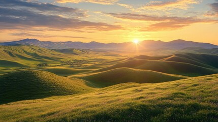 Majestic Sunrise Over Rolling Hills and Green Fields in a Serene Landscape with Soft Light and Cloudy Sky