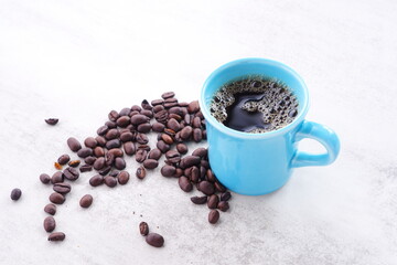 Cup of fresh Coffee with Coffee Beans
