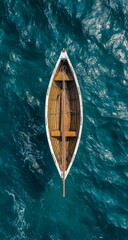 Obraz premium Overhead View of a Wooden Rowboat on Teal Water