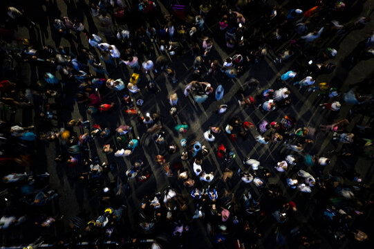 crowd people background. aerial shot of the people gathered for an event. disco night people dancing in the crowd top view. mass people gathered to celebrate an event. people are blurred into motion.