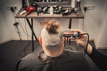 male barber and customer in shop. Beard and hairstyle. shave your bald head