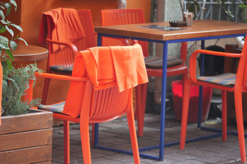 Colorful chairs and table invite outdoor seating