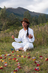 Meditating in nature surrounded by petals