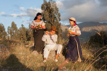 Indigenous musicians playing traditional andean music in ecuadorian highlands