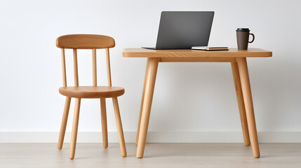 wooden table and chair with a laptop and a cup on the table